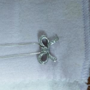 STERLING SILVER DIAMOND BOW NECKLACE 1/10 ctw